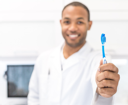 Children's Dentist Tucson Holding Toothbrush