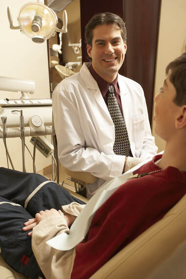 Pediatric Dentist with patient